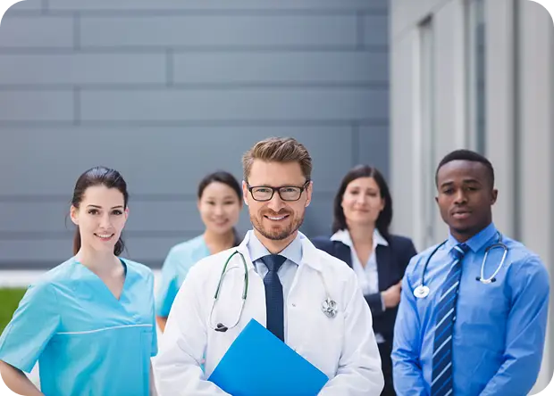 UAE healthcare professionals group including doctors and nurses standing outside hospital, related to DHA DOH MOH licensing careers