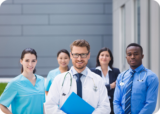 UAE healthcare professionals group including doctors and nurses standing outside hospital, related to DHA DOH MOH licensing careers
